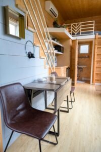 Black Leather Chair Beside Brown Wooden Table